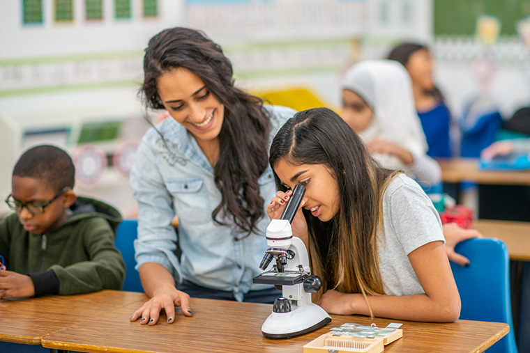 Student using Microscope